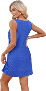 Detailed back view of a vibrant blue sleeveless hollow lace vacation dress on model