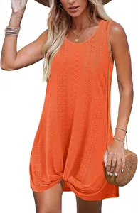 Vibrant orange eyelet summer dress with a stylish twist knot hem and sleeveless cut