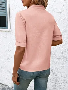 Back view of a casual pink short sleeve cotton shirt for women with textured fabric detail