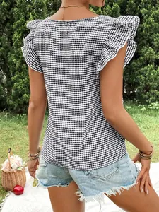 Close-up back view of a stylish black and white gingham ruffle flutter sleeve blouse top