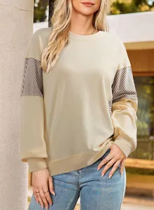 Close-up of a cream round-neck sweatshirt featuring stylish striped sleeve details