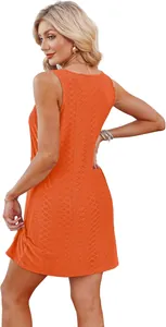 Back view of orange sleeveless openwork beach dress showing textured knit pattern