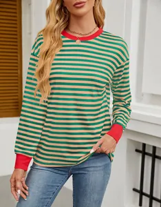 Detail of a loose green and orange striped top with red contrast cuffs and ribbed collar.