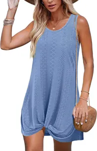 Close-up of the delicate hollow-out pattern and twist knot hem on the blue summer dress
