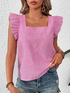 Detail of pink and white gingham blouse with ruffle sleeves and square neckline