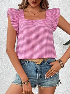 Close-up of pink gingham blouse with square neck and ruffle sleeves for summer.