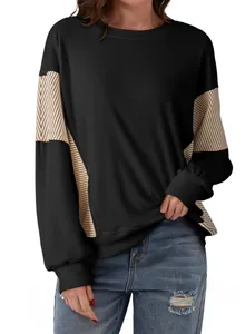 Casual women's black long sleeve sweatshirt with striped color-block panels and round neck.