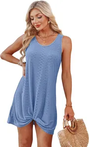 Detail view of light blue hollow-out beach dress with front twist knot hem detail.