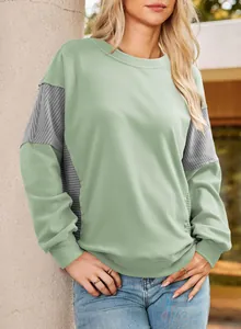 Stylish mint green sweatshirt featuring grey striped color-blocking panels on the sleeves