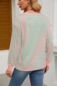 Back view of a pink and green striped long-sleeved top with a loose, comfortable fit.