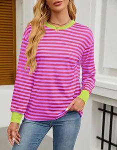 Detail shot of the vibrant pink and purple striped knit top with lime green cuffs.