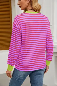 Back view of colorful striped long-sleeve top with neon green contrast cuffs