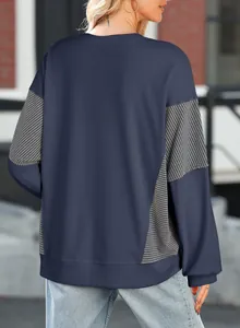 Back view of a navy blue long-sleeved sweatshirt with striped patchwork detailing