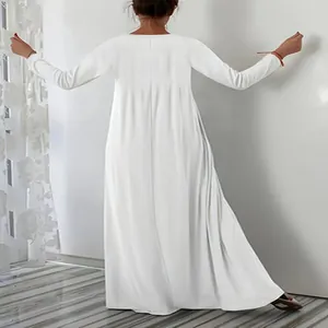 Detailed back view of a minimalist white long-sleeved floor-length maxi dress