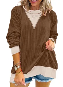 Detail view of women's casual loose color-block long-sleeve sweatshirt with ribbed texture