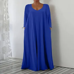 Full-length view of a vibrant blue long sleeve V-neck loose maxi dress