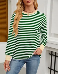 Detail view of green and white striped top with contrast yellow ribbed collar and cuffs.