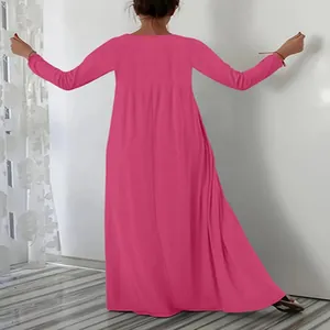 Back view of a fuchsia long-sleeved maxi dress with a relaxed flowy fit