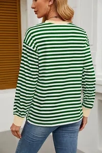 Back view of women's green white striped crew neck long sleeve top with cream cuffs