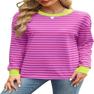 Detailed view of women's pink and purple striped top with lime green ribbed collar