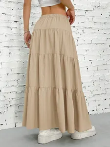 Bohemian tiered khaki maxi skirt with high elastic waist and pleated fabric texture
