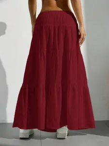 Detailed back view of a tiered maxi skirt in deep red breathable crinkle fabric