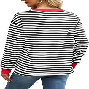Detailed back view of women's black and white striped top with red contrast cuffs