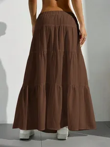 Back view of a tiered brown maxi skirt featuring a flared, loose fit casual summer style