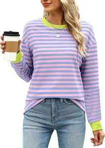 Close-up of women's striped long sleeve top featuring neon green collar and cuffs detail.
