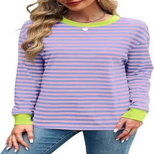 Detail of women's striped long sleeve top with neon green contrast crew neck