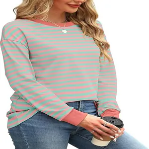 Close-up of casual striped long-sleeve top with pink and mint green color block design