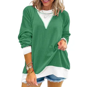 Casual color-block waffle knit sweatshirt for women with crew neck and long sleeves.