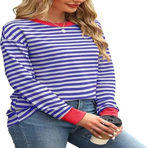 Detail of striped long sleeve top with contrasting red crew neck and cuffs
