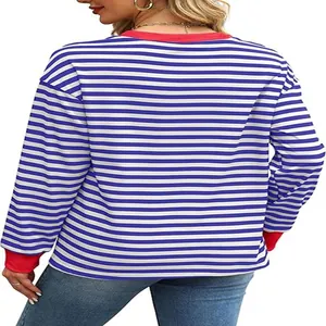 Detailed back view of women's blue and white striped long sleeve top with red contrast trim.