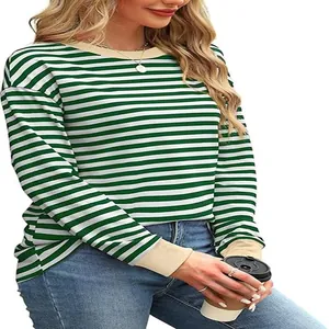 Close-up of green and white striped long sleeve shirt with contrast beige neckline