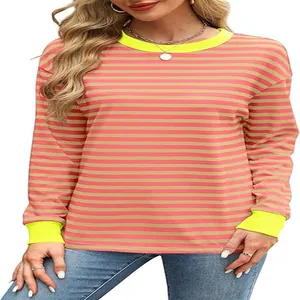 Close-up of loose-fit striped long sleeve top with neon yellow collar and cuffs.