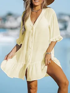 Detailed view of a stylish pale yellow V-neck ruffled beach dress cover-up for women