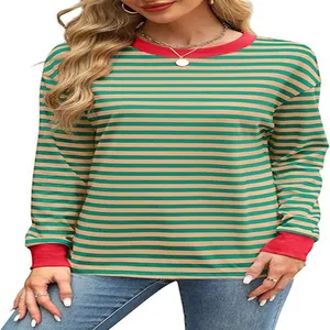 Close-up of a green and beige striped long sleeve top with a contrast red collar