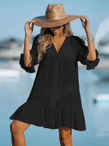 Elegant black V-neck loose beach dress with ruffle sleeves and hem for summer resort
