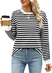 Woman wearing a casual black and white striped long sleeve crew neck top with jeans