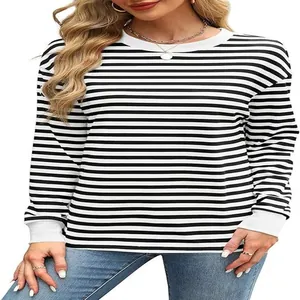Detail view of women's black and white striped long sleeve top with round neck