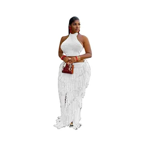 White crochet two-piece set with halter top and long fringe skirt for stylish beachwear