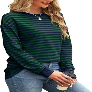 Detail view of a loose-fitting green and navy blue striped long-sleeve round neck top