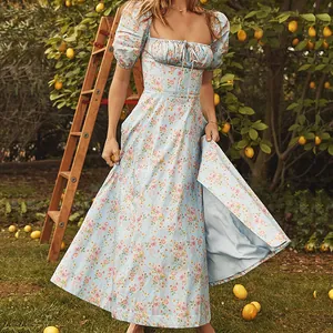 Elegant light blue floral maxi dress with square neckline and puff sleeves.