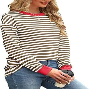 Detail shot of long-sleeved striped top featuring brown stripes and bold red ribbed cuffs
