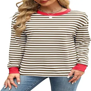 Detailed view of striped long sleeve top featuring red contrast neck and sleeve cuffs