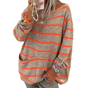 Stylish oversized crewneck knit sweater featuring orange horizontal stripes on gray