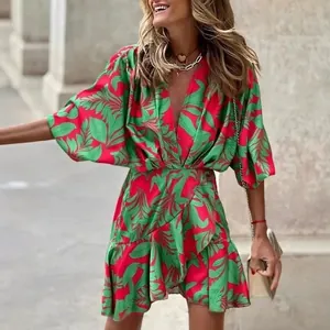 Chic tropical leaf print V-neck dress with batwing sleeves and irregular ruffled hem design