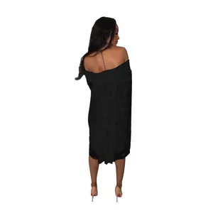 Detailed back view of women's black off-the-shoulder polka dot jacquard loose midi dress.