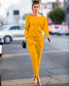 Professional street style shot of vibrant yellow two-piece leisure set for women